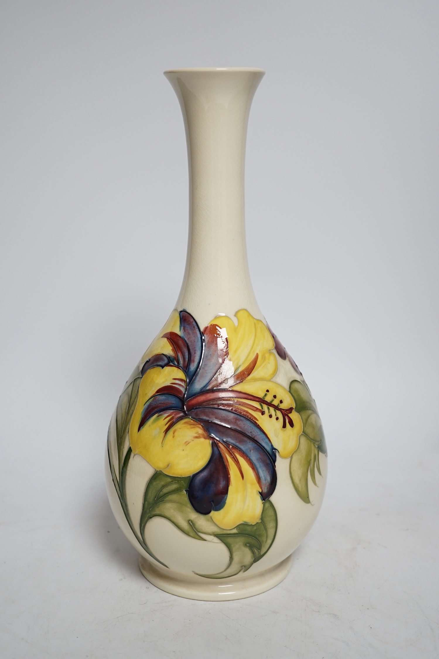 A Moorcroft cream ground Hibiscus vase, 31cm high